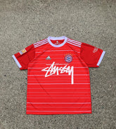 A red and white striped soccer jersey with &